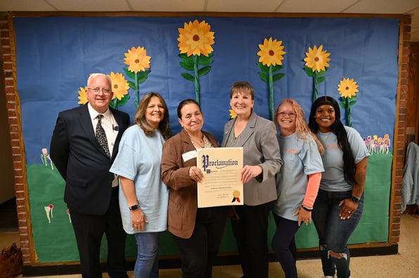 Legislator Leslie Kennedy, Comptroller John Kennedy, Brightway staff receiving proclamation