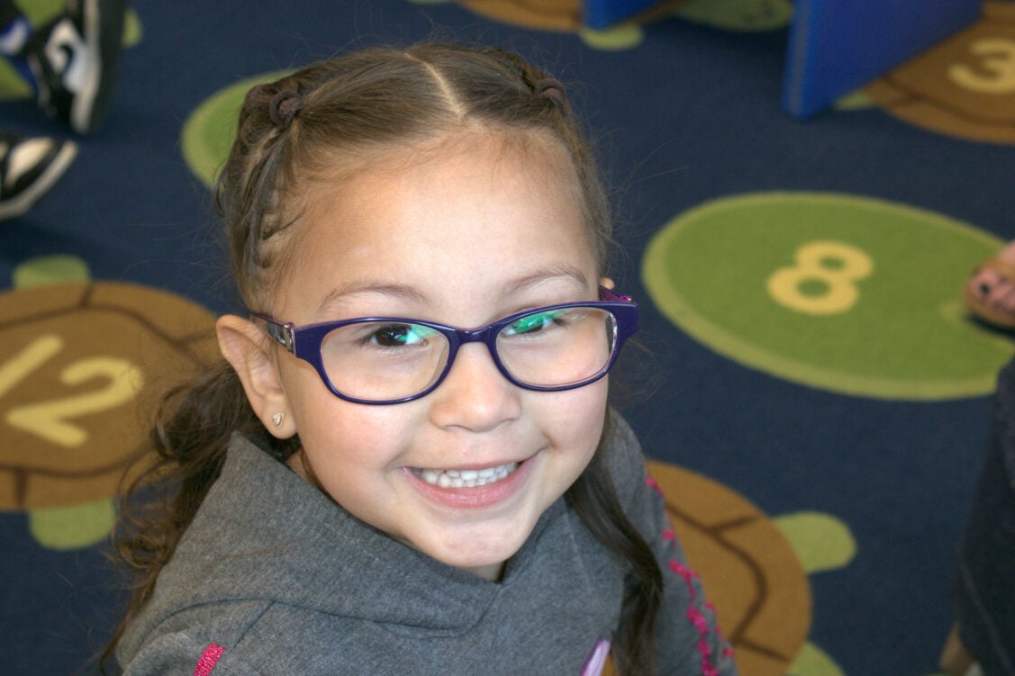 ECS Little Girl Smiling with Glasses