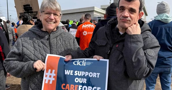 Staff and self-advocate at LI rally