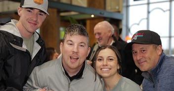 family at cornhole tournament