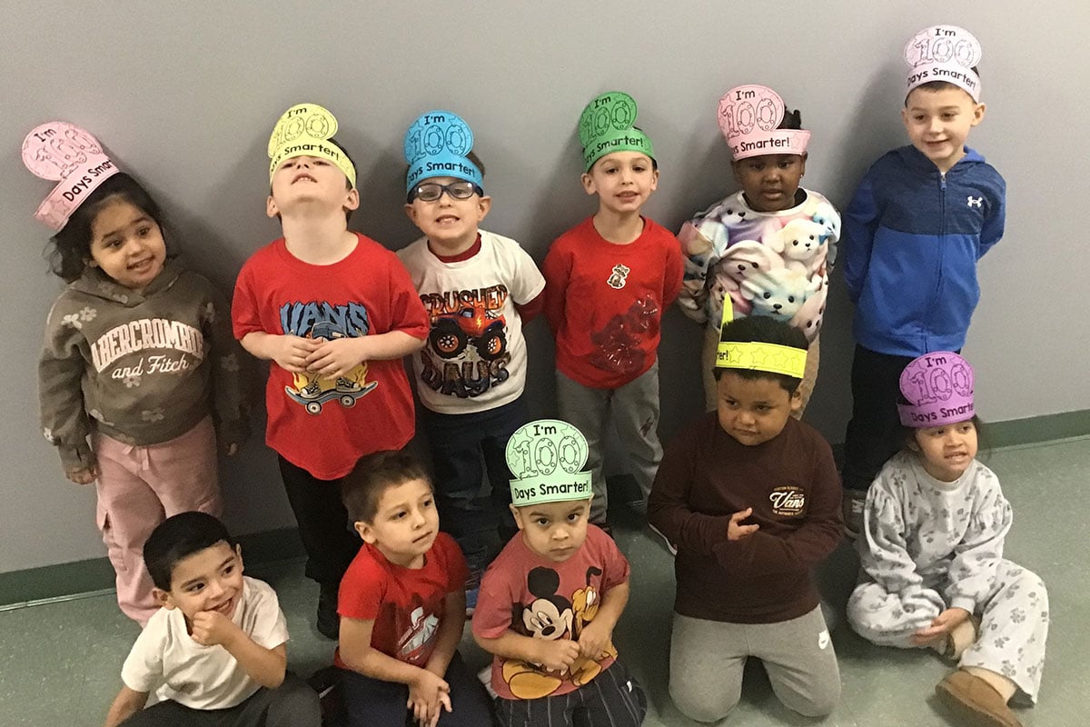 group of children wearing 100 days smarter bands on their heads