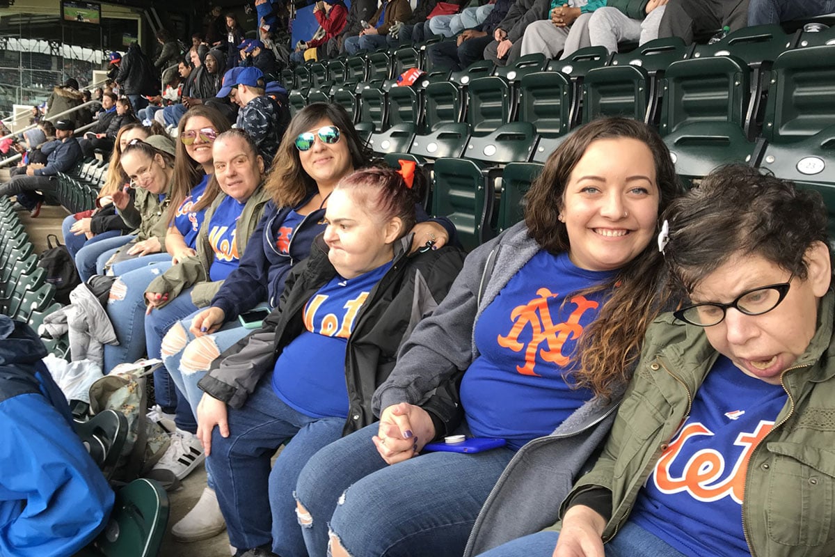 group of people at mets game in bleachers