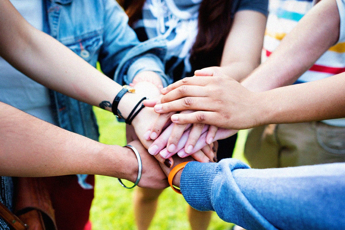 hands coming together at the center