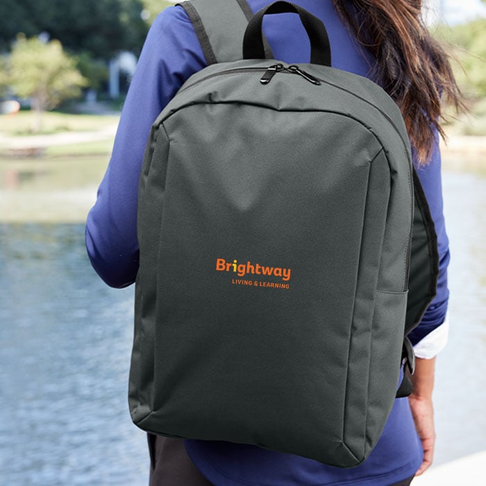 woman carrying brightway branded backpack