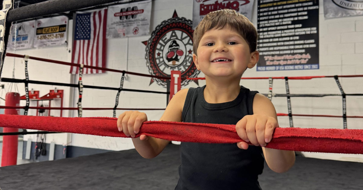 Little boy in a boxing ring