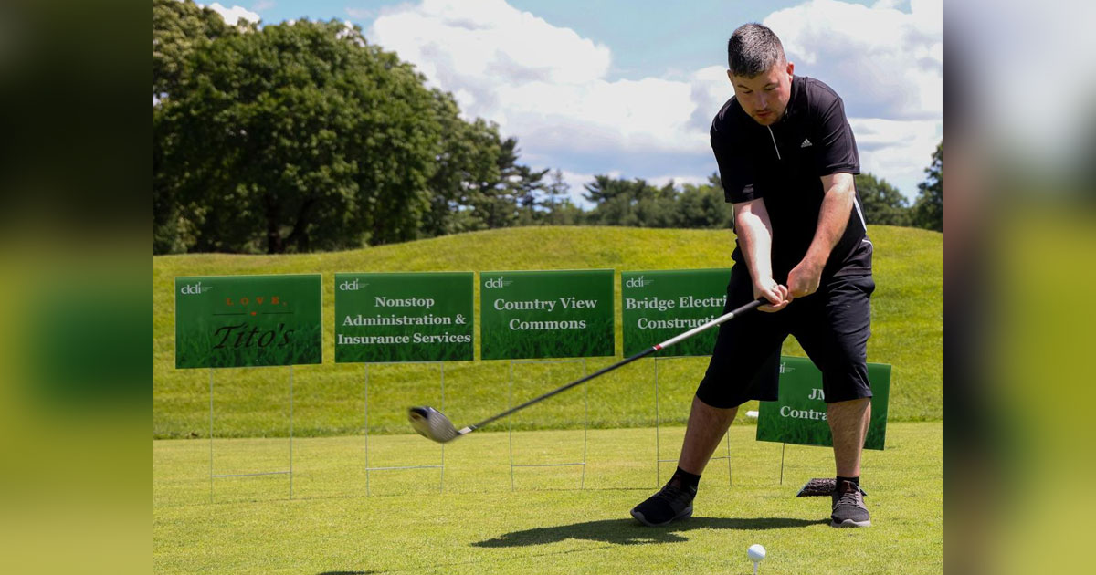 Man swinging a golf club