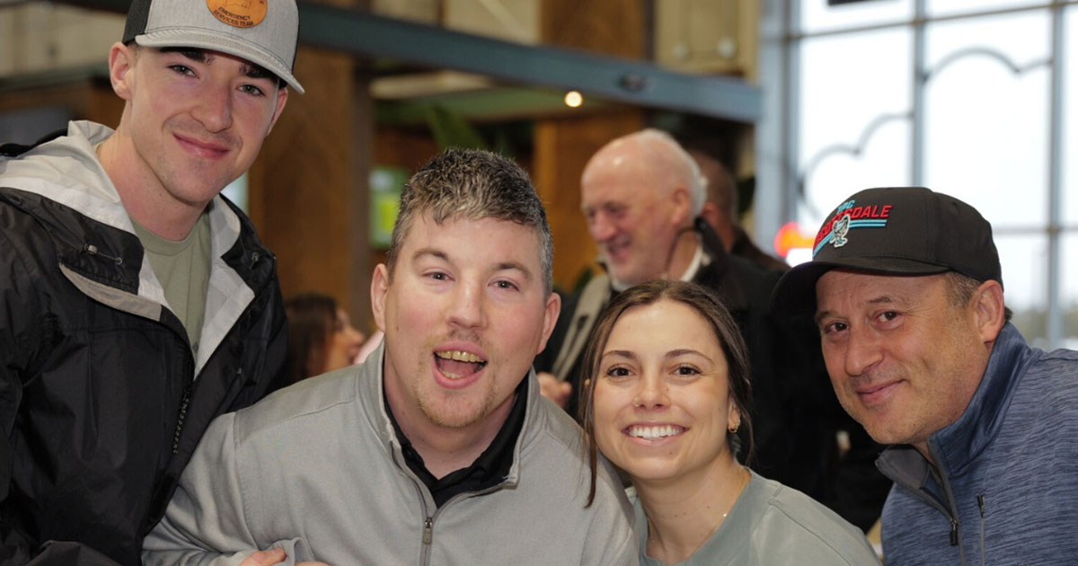 family at cornhole tournament