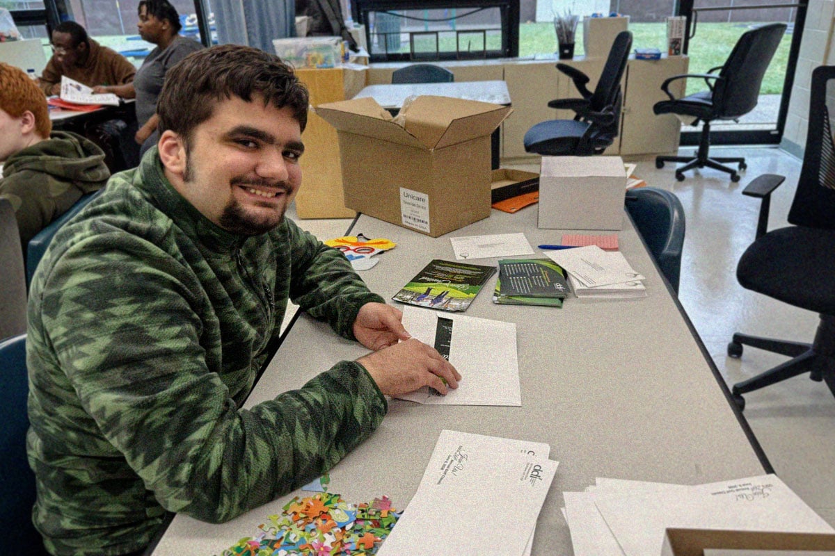 teenage-boy-sitting-at-school-desk-working-on-project teenage-boy-sitting-at-school-desk-working-on-project